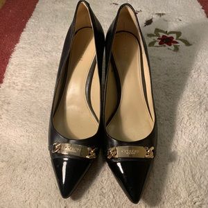 Coach black really leather heel with golden logo